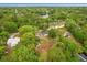 Aerial view of the property showing the lake and surrounding trees at 151 Naranja Rd, Debary, FL 32713