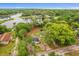 Aerial view of the property showcasing the house and lake at 151 Naranja Rd, Debary, FL 32713