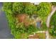 Aerial view of the property with backyard and lake at 151 Naranja Rd, Debary, FL 32713