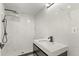 Modern bathroom with walk-in shower, floating vanity, and black fixtures at 151 Naranja Rd, Debary, FL 32713