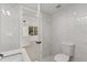 Sleek bathroom with marble tiling, and views to the kitchen at 151 Naranja Rd, Debary, FL 32713