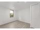 Bright bedroom with hardwood floors, closet, and window overlooking the trees at 151 Naranja Rd, Debary, FL 32713