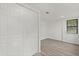 Bedroom featuring hardwood floors, closet, and window overlooking the trees at 151 Naranja Rd, Debary, FL 32713