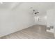 Bright living room with a ceiling fan, wood-look floors, and white walls at 151 Naranja Rd, Debary, FL 32713
