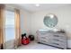 Cozy bedroom with neutral colors and ample natural light at 16369 Yelloweyed Dr, Clermont, FL 34714