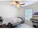 Simple bedroom with natural light and ample space at 16369 Yelloweyed Dr, Clermont, FL 34714