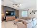 Comfortable living room featuring a large sectional sofa, and decorative lighting at 16369 Yelloweyed Dr, Clermont, FL 34714