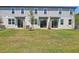 The backyard features newly laid grass and modern exterior at 16403 Bird Of Paradise Ave, Clermont, FL 34714