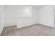 Neutral bedroom featuring plush carpeting and crisp white walls at 16403 Bird Of Paradise Ave, Clermont, FL 34714