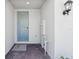 Inviting front porch area with stylish brick flooring and a modern light fixture at 16403 Bird Of Paradise Ave, Clermont, FL 34714