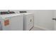 Modern laundry room featuring a Whirlpool washer and dryer at 16403 Bird Of Paradise Ave, Clermont, FL 34714