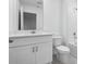 A modern bathroom features white cabinets, tile flooring, and a shower-tub combo at 16443 Bird Of Paradise Ave, Clermont, FL 34714