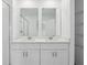 This bathroom features a double vanity with a white countertop, two mirrors, and a shower stall at 16443 Bird Of Paradise Ave, Clermont, FL 34714
