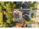 Aerial view of home with pool, solar panels, and driveway at 189 Hammock Oak Cir, Debary, FL 32713