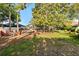 Large backyard with fire pit, mature trees and landscaping at 189 Hammock Oak Cir, Debary, FL 32713