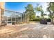 Spacious brick patio with screened-in pool area, and outdoor grill at 189 Hammock Oak Cir, Debary, FL 32713