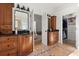 Bathroom featuring and dark wood vanities, black countertops, and a walk-in closet at 189 Hammock Oak Cir, Debary, FL 32713