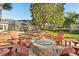 Outdoor fire pit area with seating and backyard views at 189 Hammock Oak Cir, Debary, FL 32713