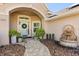 Inviting front entrance with a light blue door, tasteful decor, and beautiful landscaping at 189 Hammock Oak Cir, Debary, FL 32713