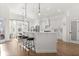Bright, open kitchen featuring a large island, pendant lighting, and modern appliances at 189 Hammock Oak Cir, Debary, FL 32713