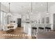 Spacious kitchen showcasing white cabinets, stainless steel appliances, and a breakfast nook at 189 Hammock Oak Cir, Debary, FL 32713