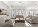 Spacious living room featuring hardwood floors, large windows, and an open layout at 189 Hammock Oak Cir, Debary, FL 32713