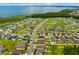 Expansive aerial shot featuring a lakeside community with manicured lawns and diverse home styles at 1910 Donahue Dr, Ocoee, FL 34761