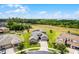 Stunning aerial view of the home surrounded by lush greenery and serene landscape at 1910 Donahue Dr, Ocoee, FL 34761