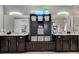 En-suite bathroom boasts dual vanities, granite countertops, and a large storage unit at 1910 Donahue Dr, Ocoee, FL 34761