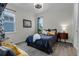 Cozy bedroom features natural light, decorative ceiling fan and comfortable furnishings at 1910 Donahue Dr, Ocoee, FL 34761