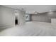 Large bonus room with neutral walls, carpet and an ensuite bathroom, ideal for a guest suite at 1910 Donahue Dr, Ocoee, FL 34761