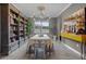 Elegant dining room with decorative lighting, built-in shelving, and stylish decor at 1910 Donahue Dr, Ocoee, FL 34761