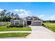 Beautiful home exterior with a well-manicured lawn and inviting curb appeal at 1910 Donahue Dr, Ocoee, FL 34761
