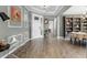 Spacious foyer boasts wood-look tile floors, decorative molding, and an elegant front door at 1910 Donahue Dr, Ocoee, FL 34761