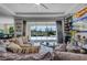 Cozy living room featuring comfortable seating and a view of the pool area at 1910 Donahue Dr, Ocoee, FL 34761