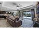 Stylish living room that offers convenient access and views of the screened pool area at 1910 Donahue Dr, Ocoee, FL 34761