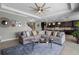 Comfortable living room open to a kitchen area with stainless steel appliances at 1910 Donahue Dr, Ocoee, FL 34761