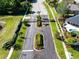 Aerial view of the gated entrance to the community. The road is well maintained and the landscaping is lush at 19319 Briercrest Trl, Orlando, FL 32833