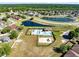 Beautiful aerial view of a community with pools, lakes, a playground, and well-maintained landscaping at 19319 Briercrest Trl, Orlando, FL 32833