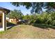 Lush backyard featuring ample space, a shed, a planter, and privacy from surrounding trees at 19319 Briercrest Trl, Orlando, FL 32833