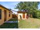Cozy backyard featuring a shed, stepping stone pathway, and green lawn at 19319 Briercrest Trl, Orlando, FL 32833