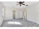 Spacious bedroom featuring new floors, multiple doorways, and an overhead fan at 19319 Briercrest Trl, Orlando, FL 32833