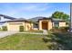 Charming one-story home with a two car garage, landscaped front yard, and walkway to the front door at 19319 Briercrest Trl, Orlando, FL 32833