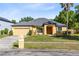 Charming one-story home with a two car garage, and a well-maintained landscaped front yard at 19319 Briercrest Trl, Orlando, FL 32833