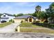 Charming one-story home with well-maintained front yard, two-car garage, and mature landscaping at 19319 Briercrest Trl, Orlando, FL 32833