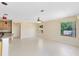 Light-filled living room with an open floor plan, large windows, and easy access to other areas at 19319 Briercrest Trl, Orlando, FL 32833