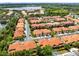 An aerial shot of a community with well-maintained homes, a lake, and beautiful landscaping at 1998 Michael Tiago Cir, Maitland, FL 32751