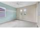 Bright bedroom featuring a ceiling fan, neutral carpet, built in shelves and abundant light from windows at 1998 Michael Tiago Cir, Maitland, FL 32751