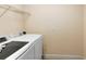 A conveniently located laundry room with modern, front-load washer and dryer at 1998 Michael Tiago Cir, Maitland, FL 32751