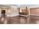 Open concept living area with wood floors, an archway, and a breakfast bar at 1998 Michael Tiago Cir, Maitland, FL 32751